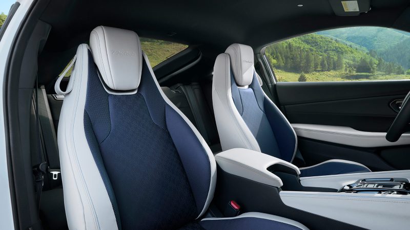 The 2026 Honda Prelude hybrid-electric sports coupe features a wide stance, flared fenders, Berlina Black wheels, and sleek GT styling.