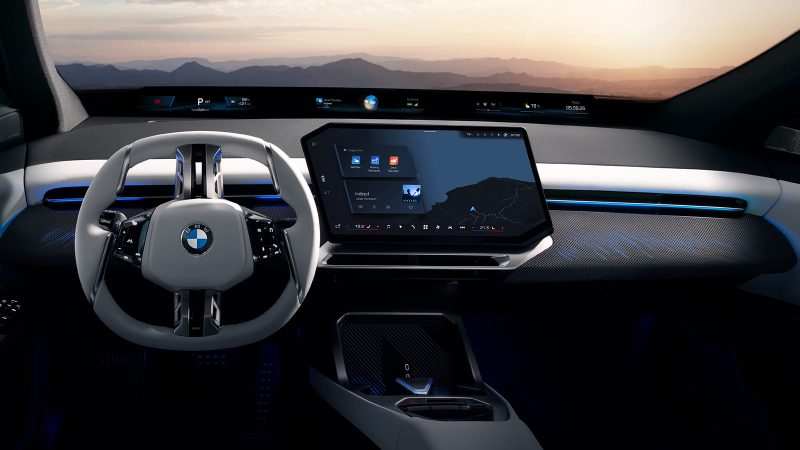 The 2026 BMW iX3, an all-electric SUV, showcases the Neue Klasse design with its slim kidney grilles, wagon-like stance, and futuristic Panoramic iDrive interior.