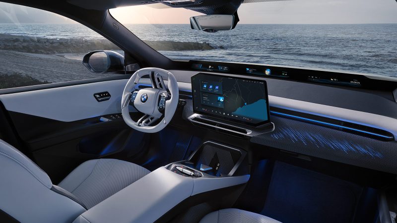 The 2026 BMW iX3, an all-electric SUV, showcases the Neue Klasse design with its slim kidney grilles, wagon-like stance, and futuristic Panoramic iDrive interior.