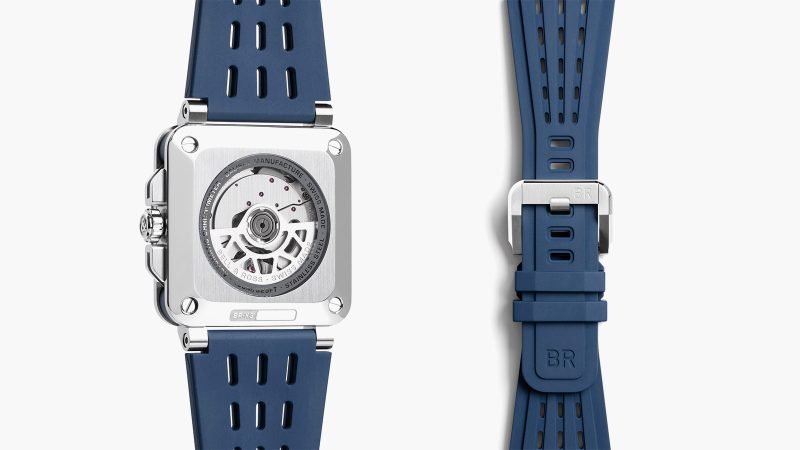The Bell & Ross BR-X3 Black Titanium watch has a multilayer titanium case, aerospace-inspired design, COSC-certified movement, aTnd a vented black rubber strap.
