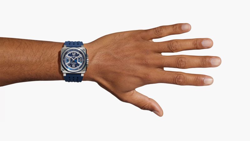 The Bell & Ross BR-X3 Black Titanium watch has a multilayer titanium case, aerospace-inspired design, COSC-certified movement, aTnd a vented black rubber strap.