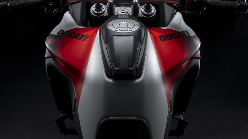 Ducati Multistrada V4 RS is a high-performance adventure motorcycle in striking Ducati Corse livery, featuring aerodynamic design, powerful V4 engine, and advanced touring technology.