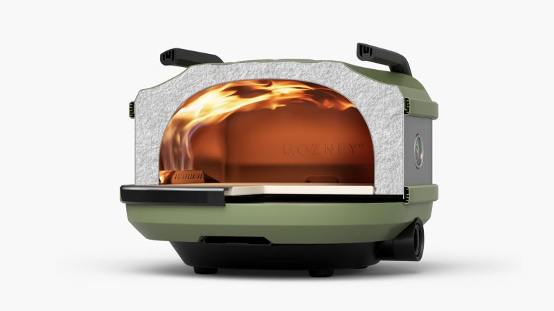 The Gozney Tread Modular Portable Pizza Oven is constructed with steel and comes with a cooking stone and gas burner.