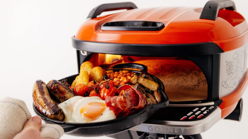 The Gozney Tread Modular Portable Pizza Oven is constructed with steel and comes with a cooking stone and gas burner.