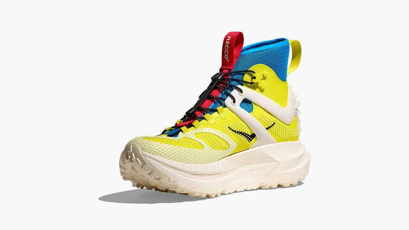 HOKA Mafate X Hike hiking boot in Citrus/Alabaster colorway with carbon fiber plate, RECCO reflector technology, neoprene collar, and cushioned outsole.