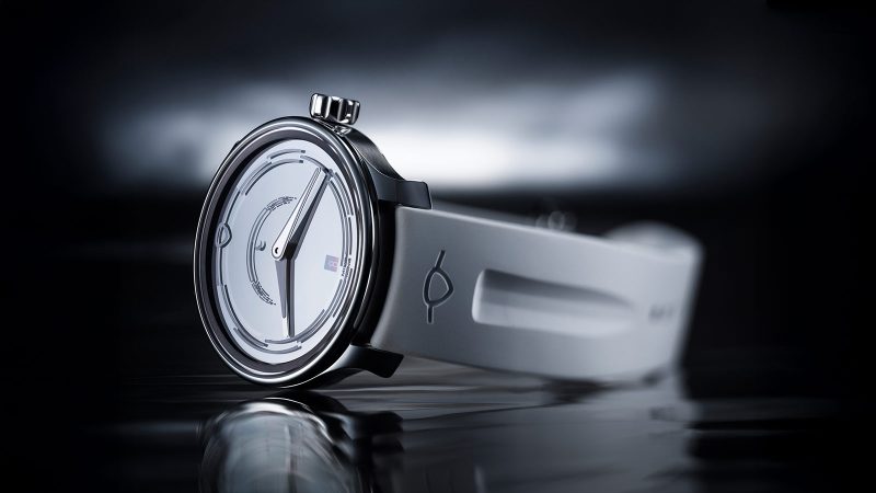 The MING 37.05 Lunatic watch has a sapphire dial, a luminous moonphase, a stainless steel 38mm case, and a white FKM rubber strap.