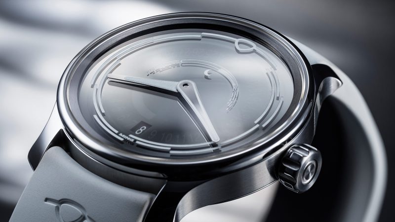 The MING 37.05 Lunatic watch has a sapphire dial, a luminous moonphase, a stainless steel 38mm case, and a white FKM rubber strap.