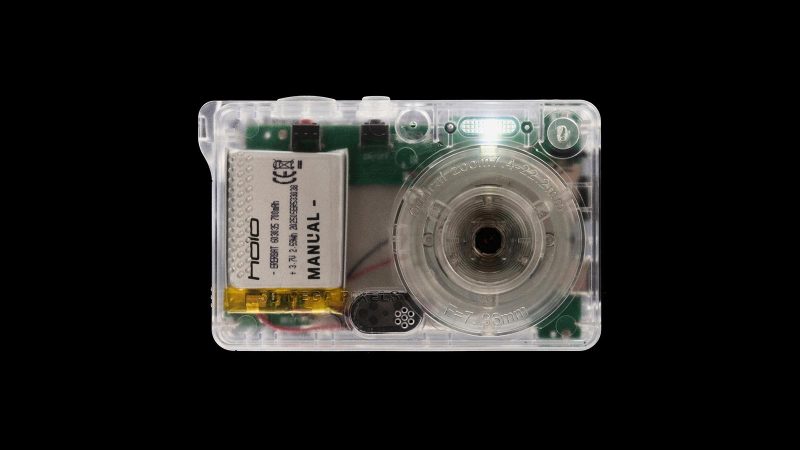 Manual HOLO transparent digital camera with Y2K-inspired design and 50MP lens.
