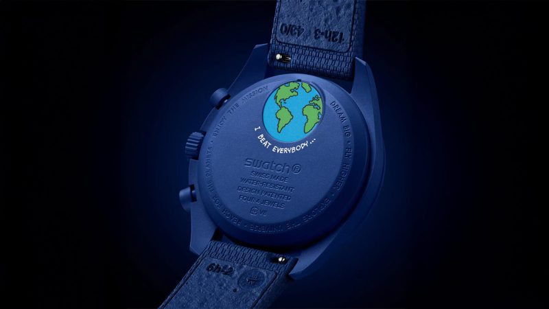 The Omega x Swatch Mission to Earthphase Moonshine Gold Corn Moon edition features a blue dial, Snoopy and Woodstock, and popcorn-box moon disc detail.