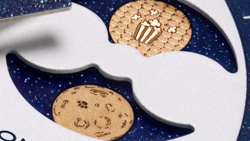 The Omega x Swatch Mission to Earthphase Moonshine Gold Corn Moon edition features a blue dial, Snoopy and Woodstock, and popcorn-box moon disc detail.
