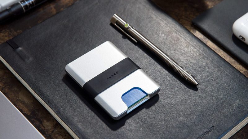 The James Brand Lowe minimalist CNC aluminum wallet features a silicone band, RFID protection, and an ultra-slim design for everyday carry.