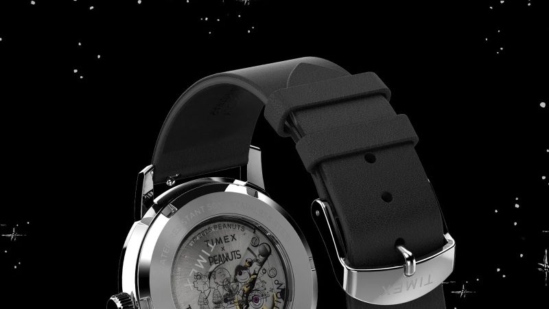 The Timex x Peanuts Marlin Automatic Space watch with Snoopy floating second hand, 40mm stainless-steel case, silver sunray dial, and eco-friendly leather strap.