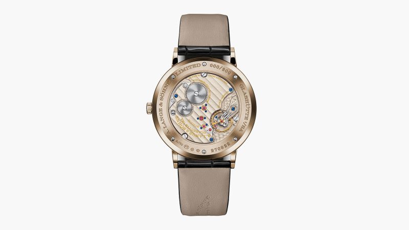 The A. Lange & Söhne Saxonia Thin Onyx Edition wristwatch showcases a black onyx dial in Honeygold and Platinum with a minimalist design and precision craftsmanship.