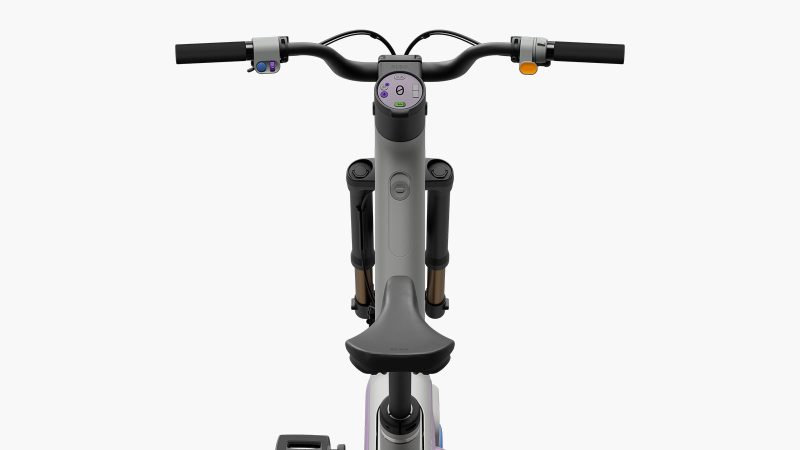 The Also TM-B Launch Edition e-bike in matte silver with a 5-inch digital display and a modular frame, designed by Rivian spinoff for next-gen commuting.