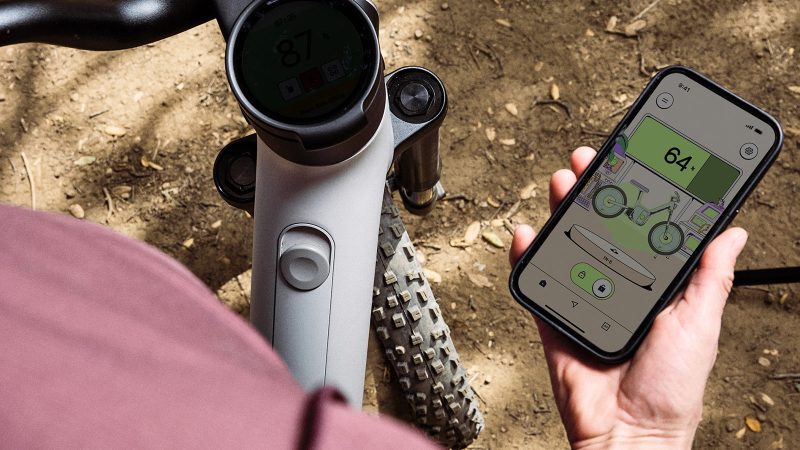 The Also TM-B Launch Edition e-bike in matte silver with a 5-inch digital display and a modular frame, designed by Rivian spinoff for next-gen commuting.