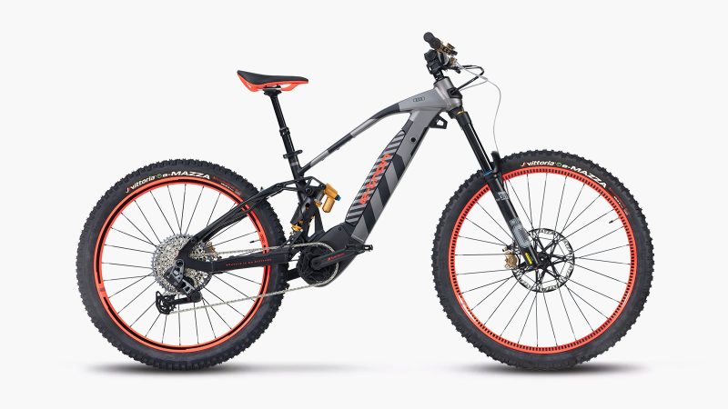 Audi eMTB 2.0 electric mountain bike with Dakar-inspired livery, Öhlins suspension, SRAM GX drivetrain, and Brose motor delivering 90Nm torque.