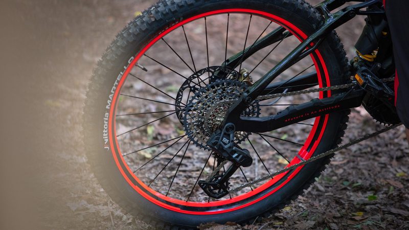 Audi eMTB 2.0 electric mountain bike with Dakar-inspired livery, Öhlins suspension, SRAM GX drivetrain, and Brose motor delivering 90Nm torque.