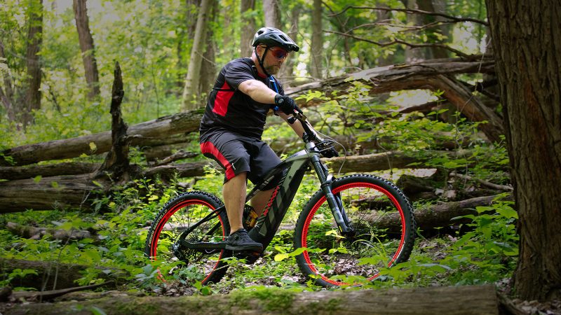 Audi eMTB 2.0 electric mountain bike with Dakar-inspired livery, Öhlins suspension, SRAM GX drivetrain, and Brose motor delivering 90Nm torque.