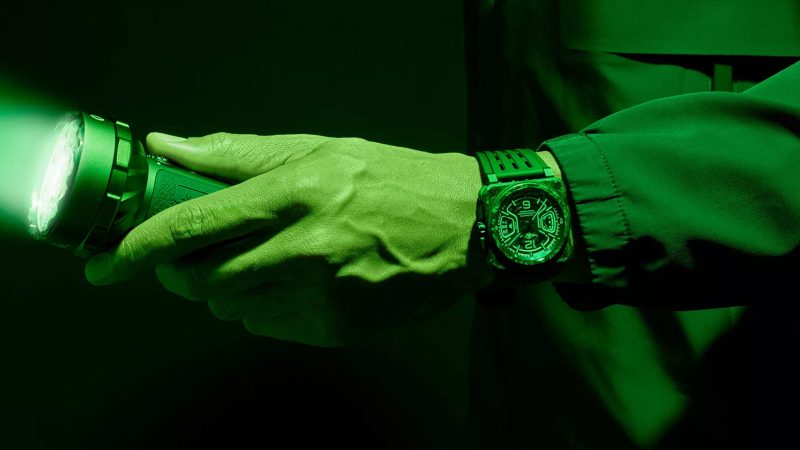 The Bell & Ross BR-X3 Night Vision luminous carbon-fiber watch with green accents and titanium case.