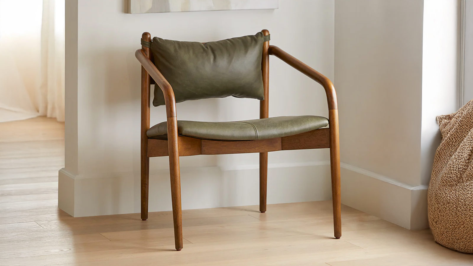 Article Lento Leather Lounge Chair in charcoal-green buffalo leather with walnut frame, a refined accent chair for men’s modern interiors.