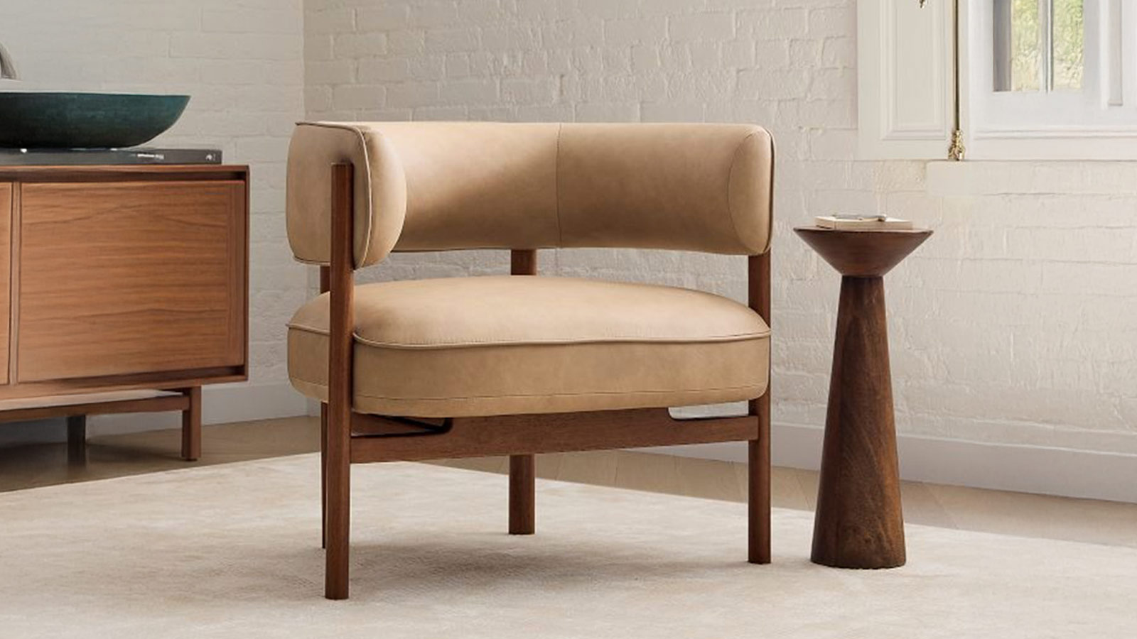 West Elm Craig Leather Chair with solid wood frame, a sophisticated accent chair for men’s modern homes.