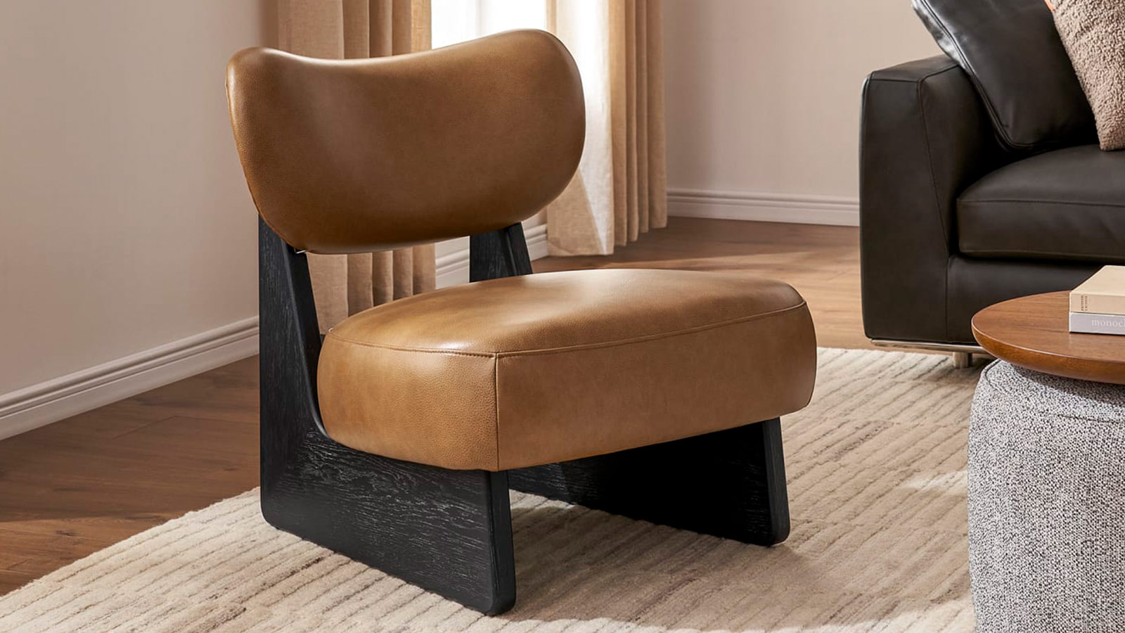 Castlery Solange Leather Chair in tan top-grain leather with oak-edged legs, a bold minimalist accent chair for men’s interiors.