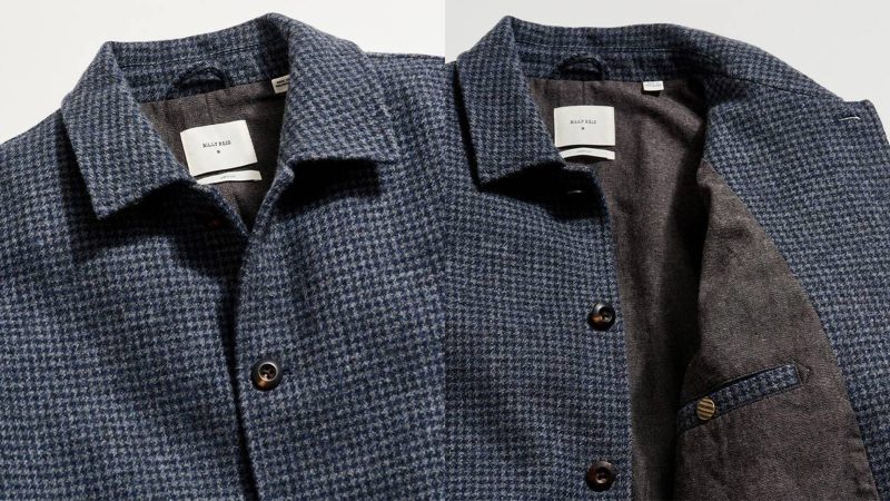 Billy Reid Bennet Overcoat in navy wool blend, styled with dark horn buttons and chambray lining for refined cold-weather versatility.