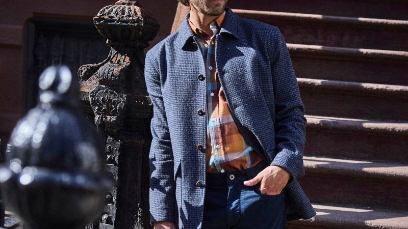 Billy Reid Bennet Overcoat in navy wool blend, styled with dark horn buttons and chambray lining for refined cold-weather versatility.