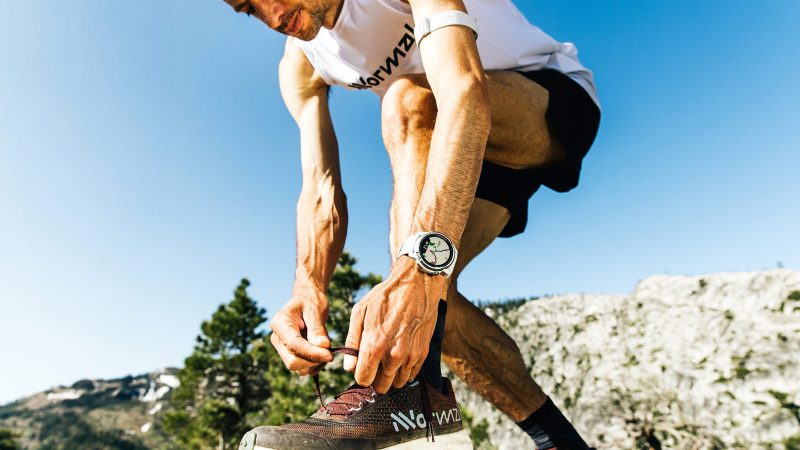 The COROS Apex 4 GPS Outdoor Watch features a titanium bezel, a sapphire crystal display, and a rugged, sporty design.