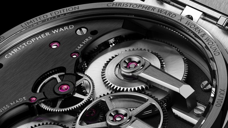 The Christopher Ward x Worn & Wound C12 Brooklynite watch features a champagne dial, an open balance, and Art Deco-inspired detailing.