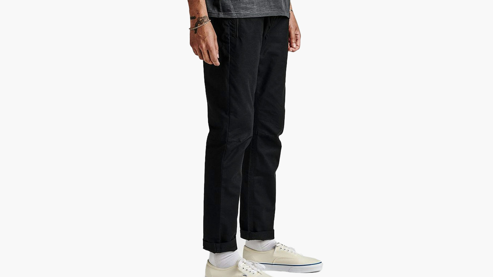 Black slim-fit travel pants for men that blend trail durability with urban style for fall 2025.