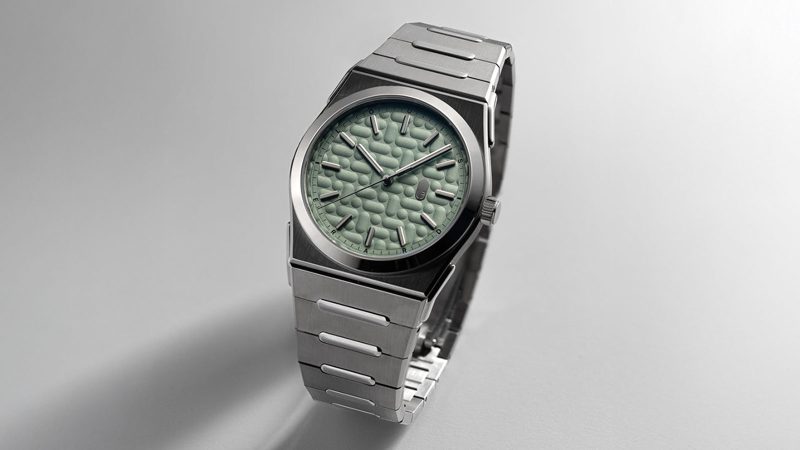 The Louis Erard 2340 sports watch boasts an integrated titanium-steel bracelet and textured dial.