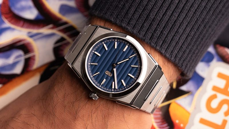 The Louis Erard 2340 sports watch boasts an integrated titanium-steel bracelet and textured dial.