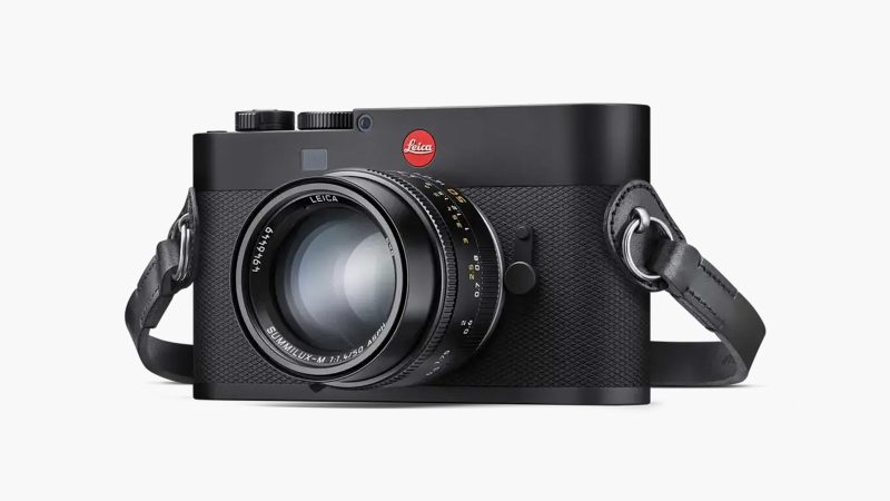 The Leica M EV1 full-frame digital camera in black metal, showing minimalist front panel without rangefinder window and 5.76-million-dot EVF.