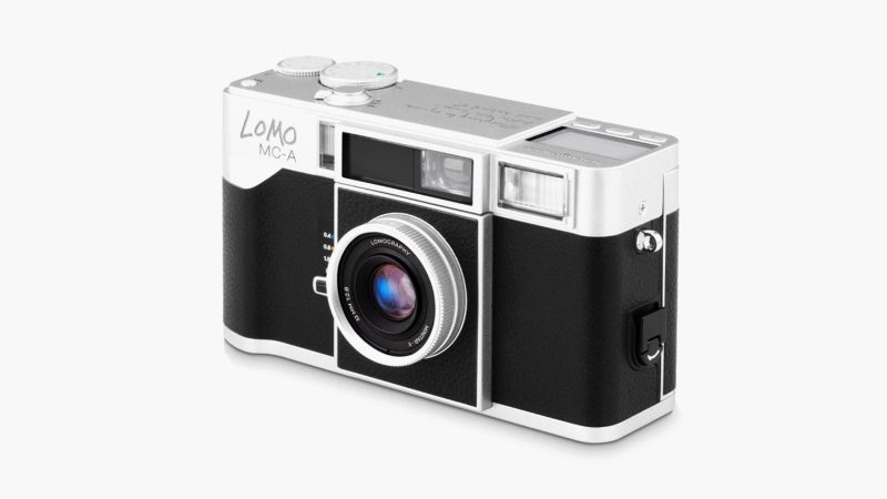 Lomo MC-A 35 mm Film Camera available in black and silver metal with retractable 32 mm f/2.8 lens and built-in flash.