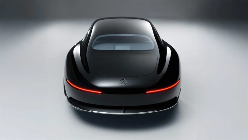 The Mercedes Vision Iconic concept EV features a long hood, solar panel surfaces, an illuminated grille, vintage coupe proportions, and futuristic detailing