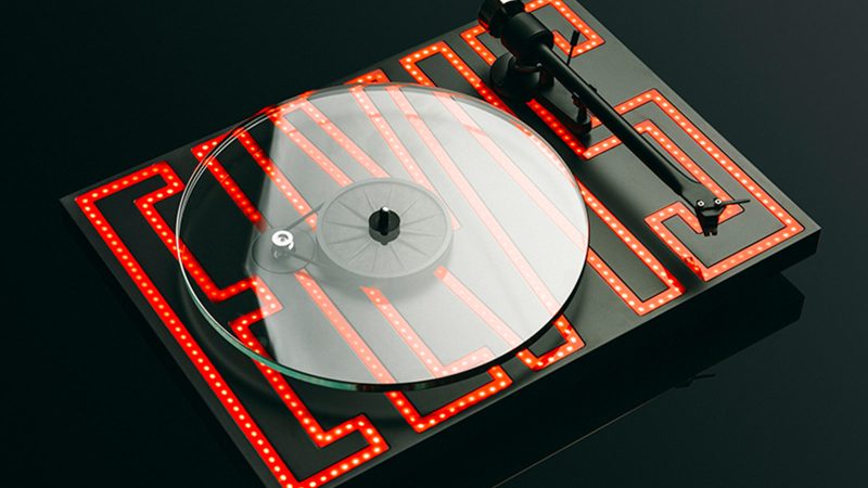 The Pro-Ject Elvis limited edition turntable features a glass platter, a Sumiko Rainier MM cartridge, a CNC plinth, and Elvis-inspired artwork.