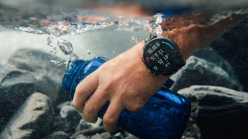 The Suunto Vertical 2 smartwatch features an AMOLED display, dual-band GPS, a flashlight, and a rugged titanium or stainless steel build.