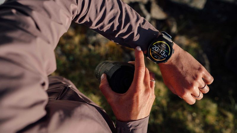The Suunto Vertical 2 smartwatch features an AMOLED display, dual-band GPS, a flashlight, and a rugged titanium or stainless steel build.