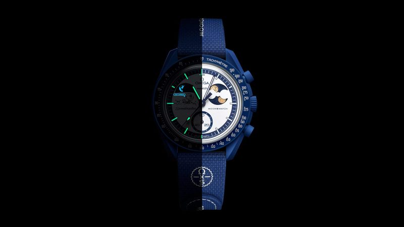 The Swatch Mission to Earthphase Moonshine Gold watch boasts a glowing Earth indicator and Moonshine Gold moon phase design.