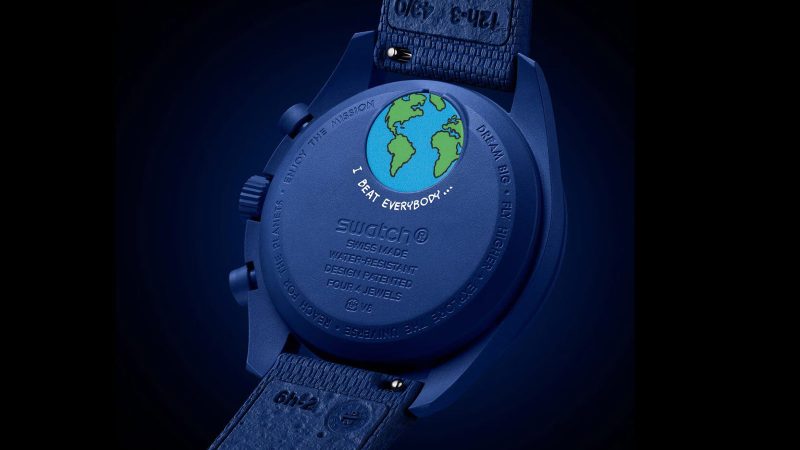 The Swatch Mission to Earthphase Moonshine Gold watch boasts a glowing Earth indicator and Moonshine Gold moon phase design.