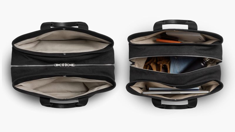 Shinola’s Runwell Canvas Duffle Bag in black canvas with leather trim, matte nickel hardware, and a TSA-approved carry-on design.