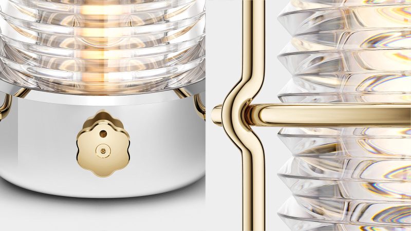 LoveFrom x BALMUDA Sailing Lantern in polished stainless steel with gold accents, suspended by a woven marine-grade lanyard.