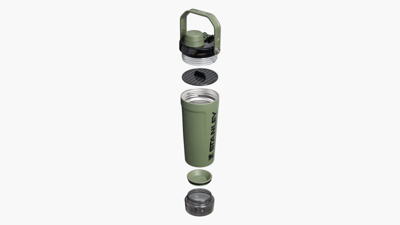 The Stanley Activate Shaker Bottle 20 oz in matte black, stainless steel insulated body, fast-flow spout, base container for supplements, and soft ergonomic carry handle.