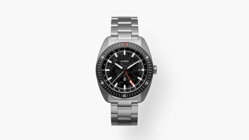 The James Brand × Timex Automatic GMT Nocturne Edition watch with carbon fiber dial, stainless-steel case, and ceramic bezel.