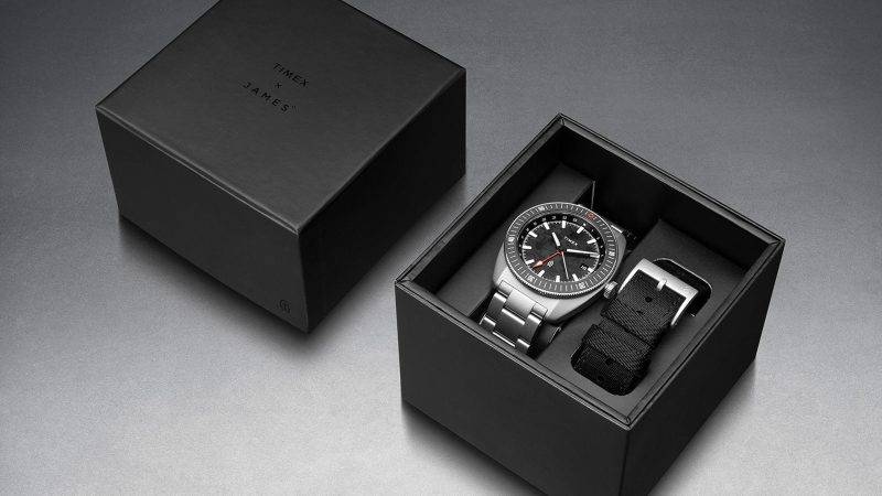 The James Brand × Timex Automatic GMT Nocturne Edition watch with carbon fiber dial, stainless-steel case, and ceramic bezel.