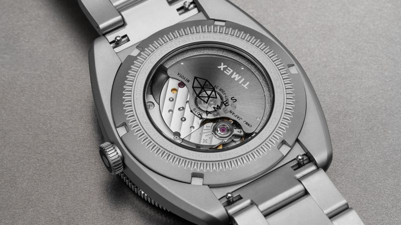 The James Brand × Timex Automatic GMT Nocturne Edition watch with carbon fiber dial, stainless-steel case, and ceramic bezel.