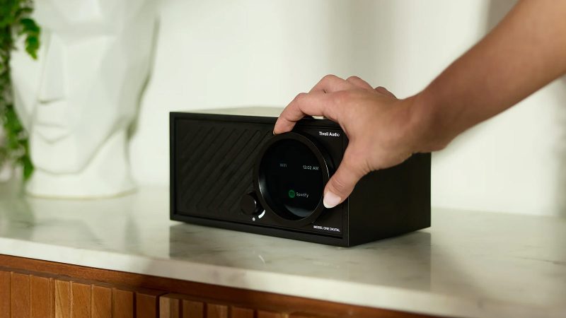 Tivoli Audio Model One Digital Generation 3 tabletop radio-speaker in walnut finish with brushed metal grille and digital display.