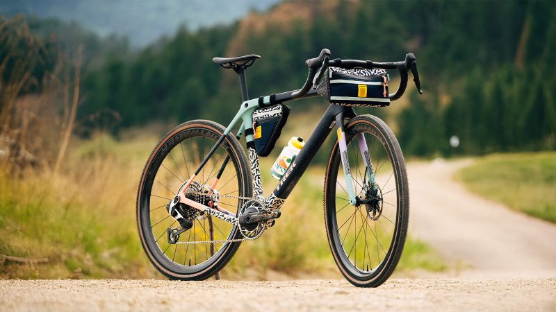 Trek x Topo Designs Project One ICON Checkmate Gravel Bike, featuring bold patterns and rugged outdoor performance, with bags.