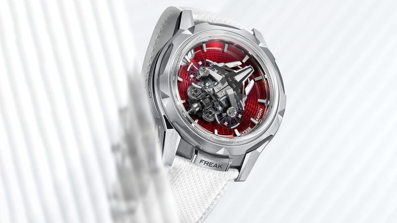 The Ulysse Nardin Freak S Enamel is available in ruby red and turquoise blue, with a titanium case and dual-oscillator movement visible under a domed sapphire crystal.